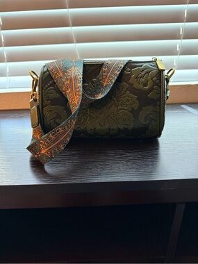 Embossed Olive Green Barrel Crossbody Bag with Patterned Strap